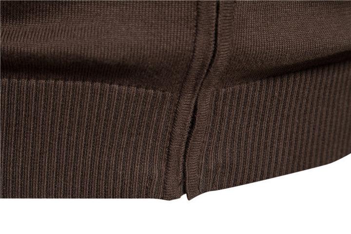 Studio shot of a men's colorblock zip-up cardigan sweater against a neutral background.
