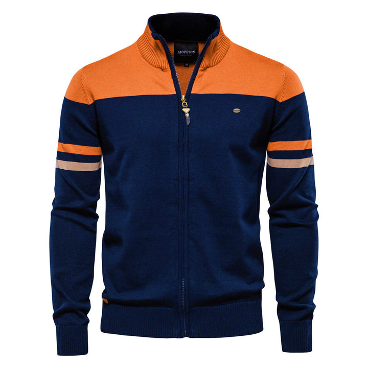 Close-up of the knit texture on a men's colorblock zip-up cardigan sweater, casual outerwear.