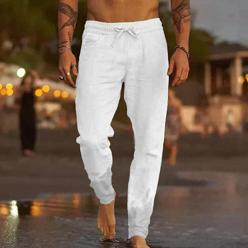 Relaxed fit men's athletic jogger pants with an adjustable drawstring, ideal for active lifestyles.