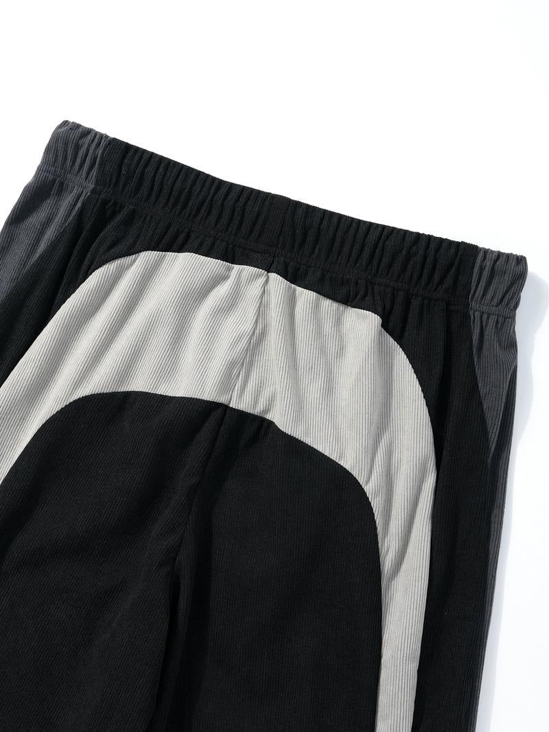 Stylish men's corduroy joggers in a vibrant color-block design, versatile for athletic or casual outfits.