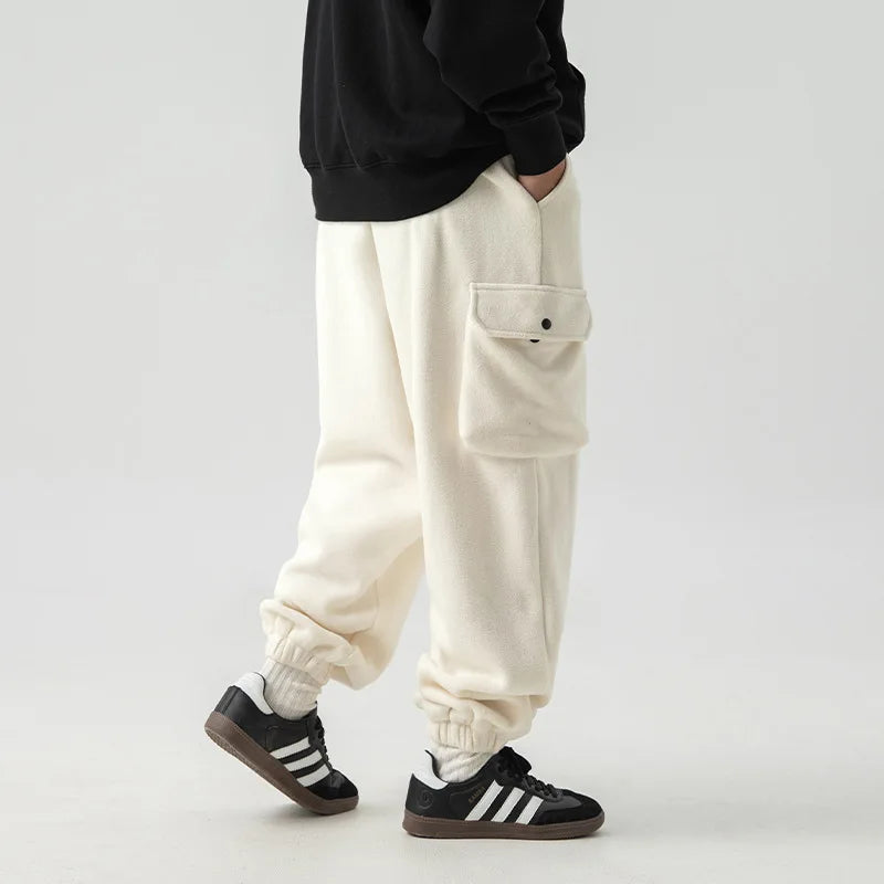 Close-up of the soft fleece lining inside men's cargo pants, highlighting comfort and warmth for cold weather.