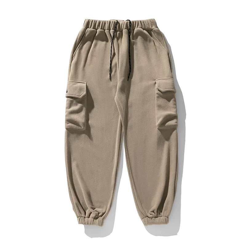 Men's comfortable navy fleece cargo pants, showing practical side pockets, ideal for outdoor or casual use.