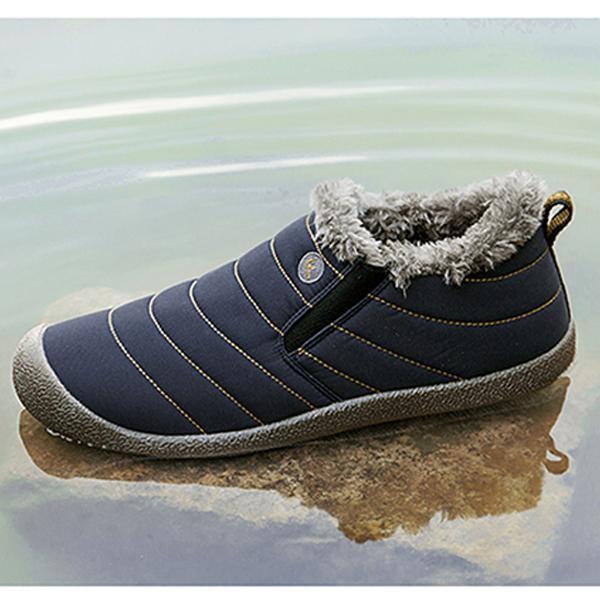 Close-up of men's cotton snow boots, faux fur lining visible, warm winter shoes