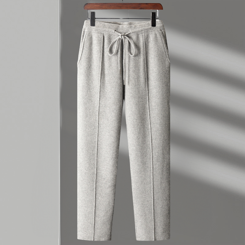 Man stretching in merino blend lounge pants, emphasizing freedom of movement and softness.