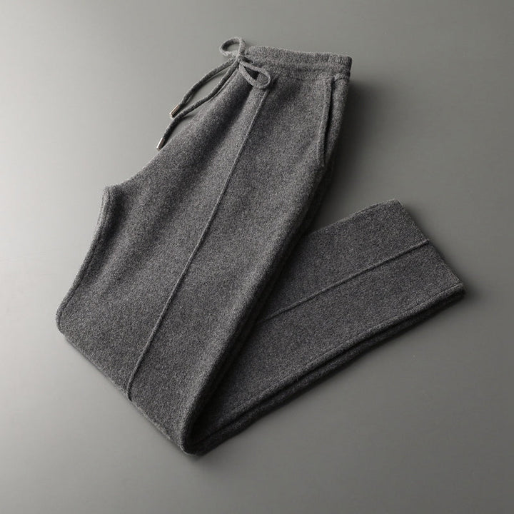 Lifestyle shot of men's merino blend lounge pants, paired with a casual top, relaxation focus.