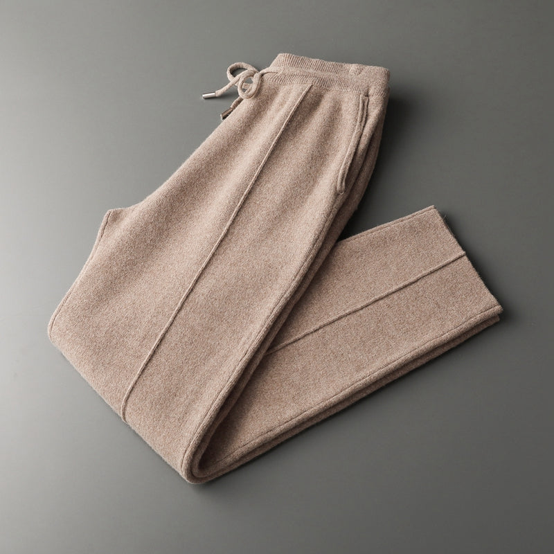 Full shot of charcoal men's merino blend lounge pants, depicting elastic waist, comfortable fit.