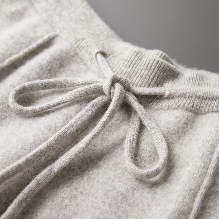 Back view of men's merino blend lounge pants, showing pockets and relaxed fit, soft material.
