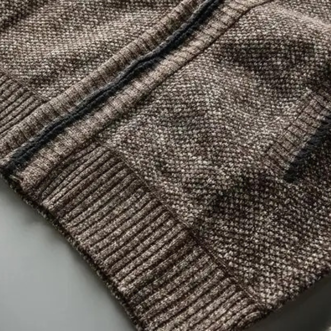 Rugged men's Cumberland winter coat with a soft fleece lining and knit texture, durable