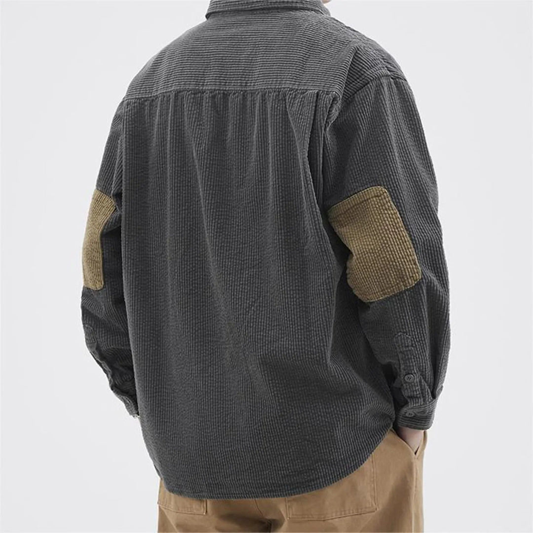 Casual men's beige corduroy shirt with long sleeves and button-up front