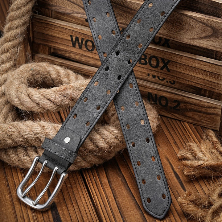Men's black perforated leather belt with a distressed finish, versatile for both casual wear and work aesthetics.