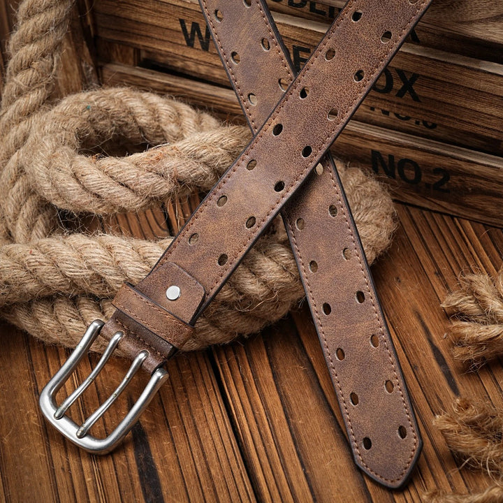 A pair of men's distressed leather belts, one brown and one black, both with a distinctive perforated design.