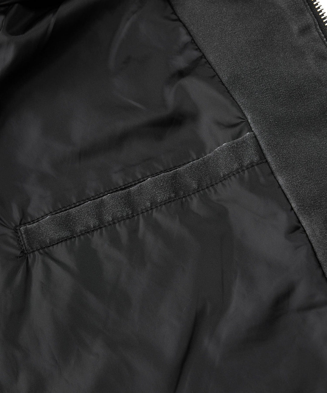 Close-up of the collar and hood area of the men's distressed canvas urban jacket