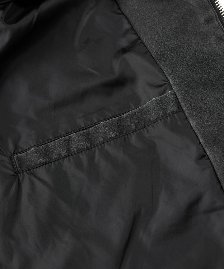 Close-up of the collar and hood area of the men's distressed canvas urban jacket