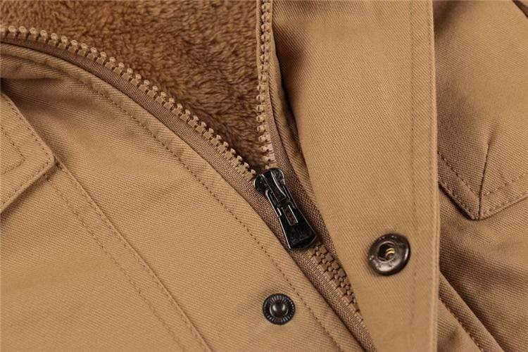 Zipper and pocket detail on a men's durable cotton pilot bomber jacket with warm fleece lining