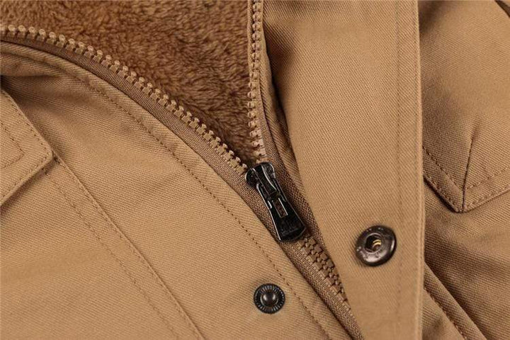 Zipper and pocket detail on a men's durable cotton pilot bomber jacket with warm fleece lining