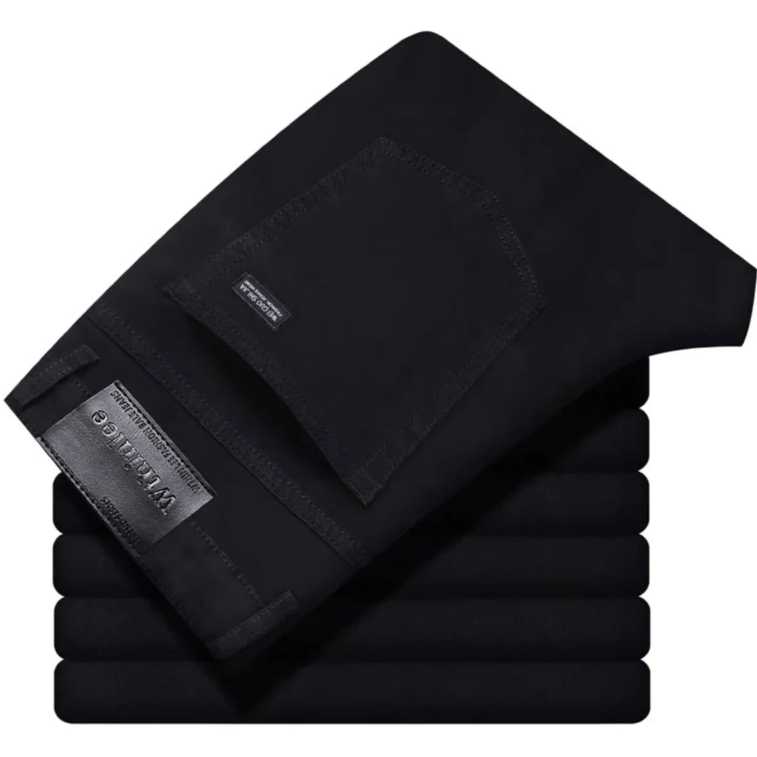 Detailed view of stitching on men's stretch denim jeans, highlighting quality and durability.