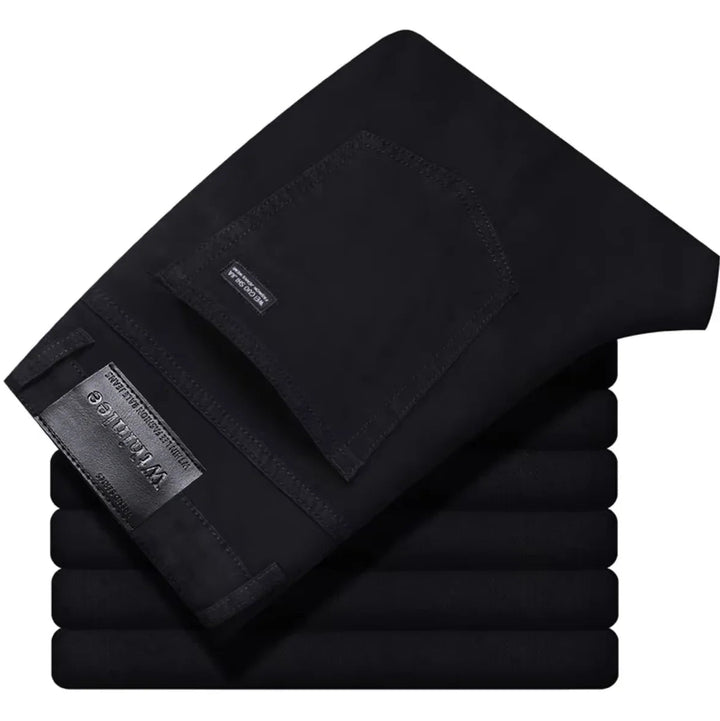 Detailed view of stitching on men's stretch denim jeans, highlighting quality and durability.