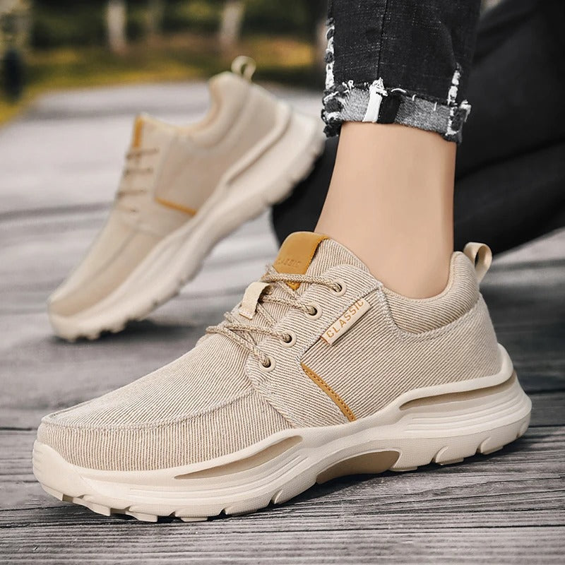 Pair of men's gray canvas comfort sneakers, ideal for everyday casual style and comfort.