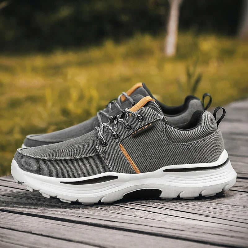 Top down view of men's khaki canvas comfort sneakers, showcasing their breathable and casual design.