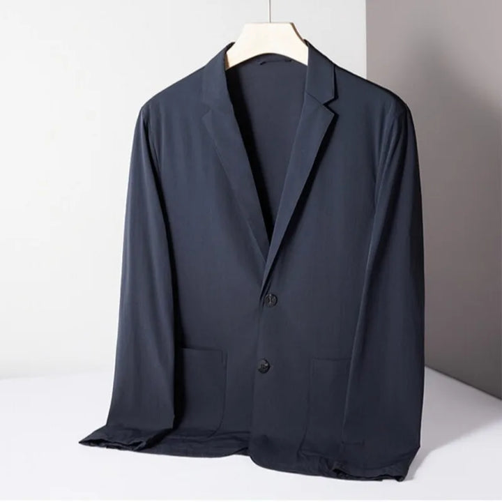 Lightweight men's performance stretch blazer in charcoal gray, offering comfort and versatility