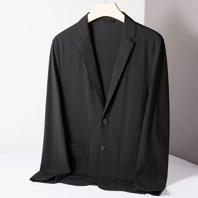 Man wearing a stylish men's everyday performance stretch blazer, ideal for work, travel, and casual occasions