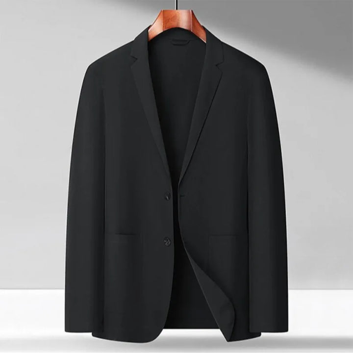 Detailed view of the buttons and lapel on a black men's stretch performance blazer, a versatile wardrobe essential