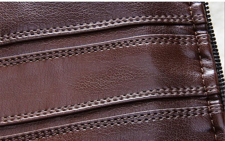Detailed shot of zipper and pockets on a men's brown faux leather fur-lined jacket