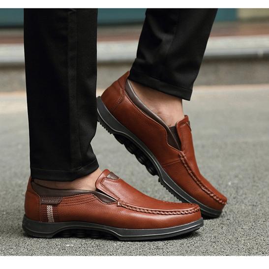 Men's slip-on loafers featuring rich faux leather texture.
