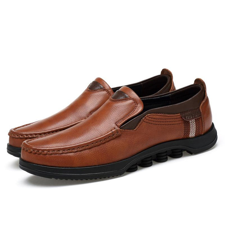 Stylish men's brown faux leather slip-on loafers, perfect for casual outings.