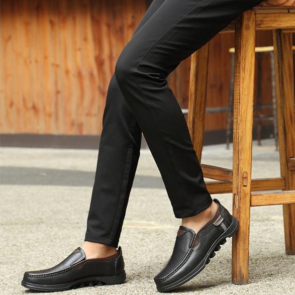 Close-up of the upper on men's faux leather casual slip-on loafers.