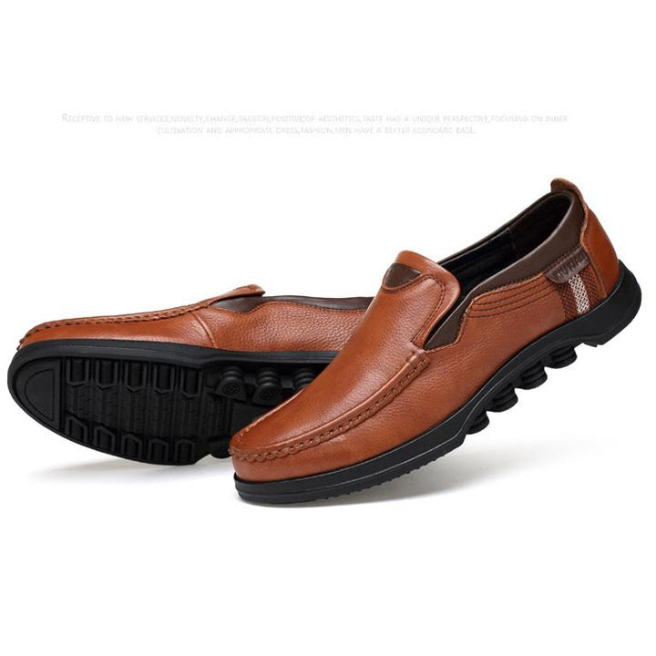 Top-down view of men's casual faux leather loafers, showing sleek shape.