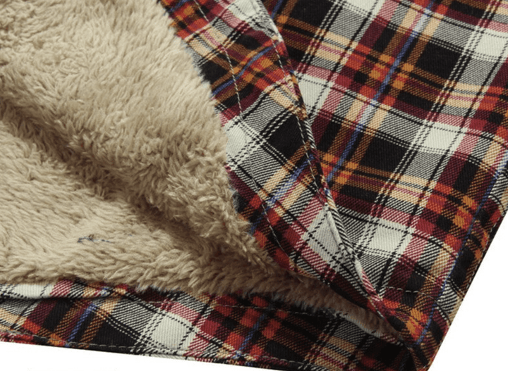 Stylish men's red wine flannel lined jacket, paired with jeans, demonstrating a complete casual winter outfit