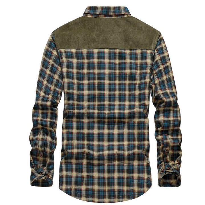 Close-up of the durable snap buttons on a men's blue flannel lined jacket, highlighting quality stitching