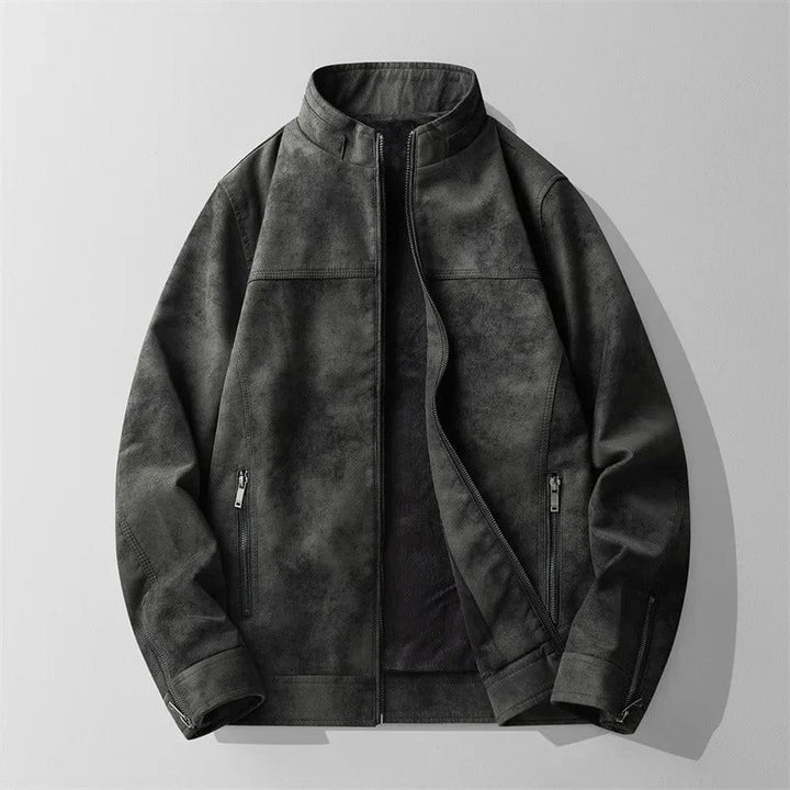 Close-up of a men's suede-like jacket with soft fleece lining, perfect for cold weather. Features zippered pockets.