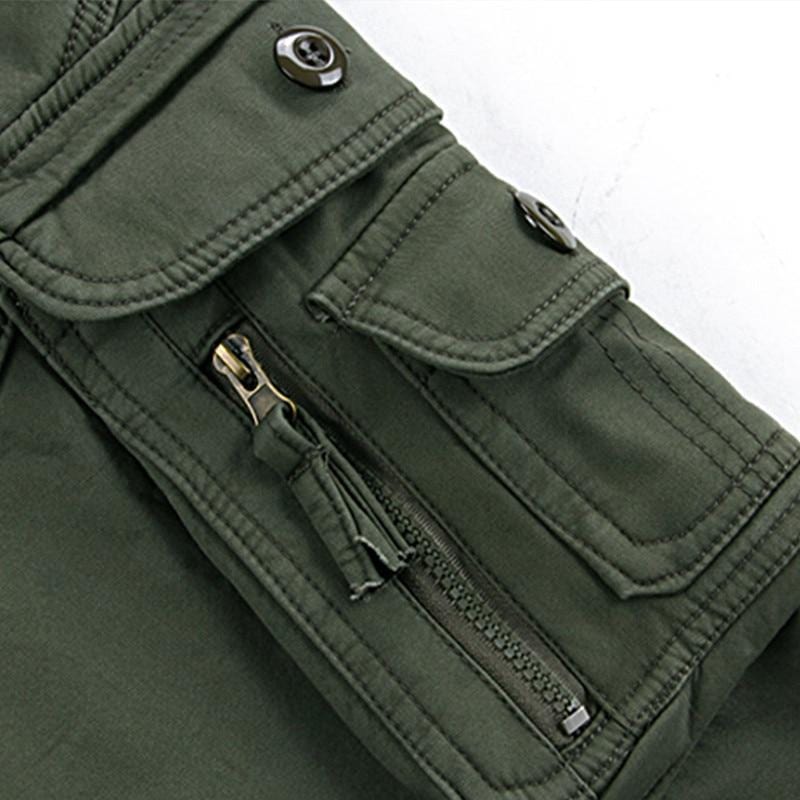 Full-length view of men's fleece-lined tactical outdoor pants in a dark color with pockets