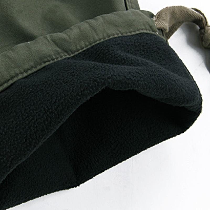 Rugged men's cotton tactical pants with warm fleece lining, designed for durability and comfort