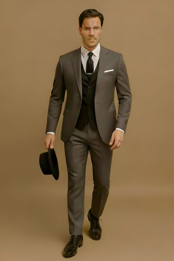 Hanger shot of a men's three-piece spring suit, showcasing the full formal ensemble