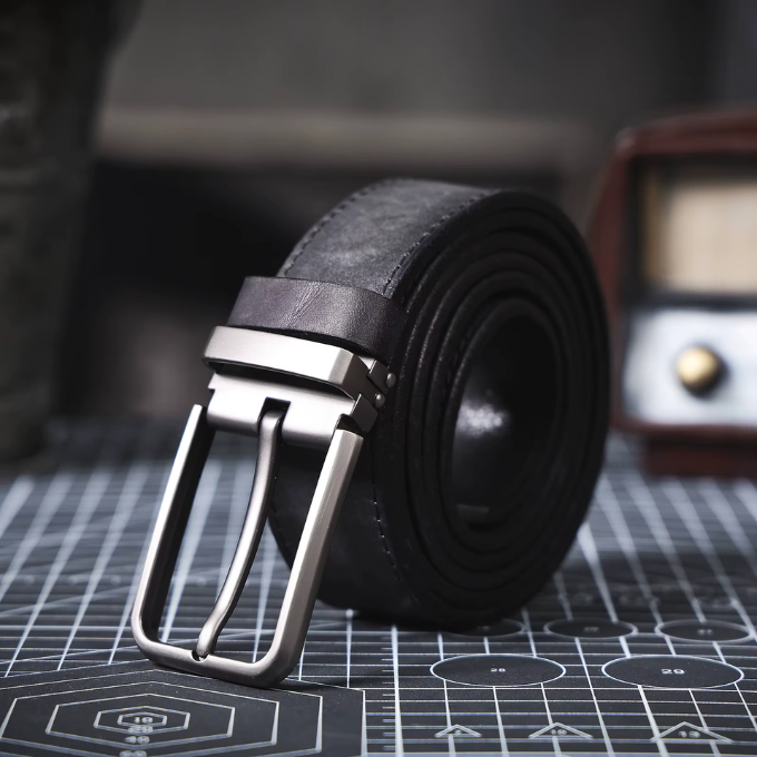 Close-up of a men's full-grain black leather belt buckle, perfect for casual style