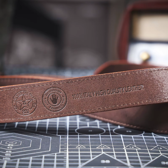 Rugged black full-grain leather belt, an essential men's accessory for jeans