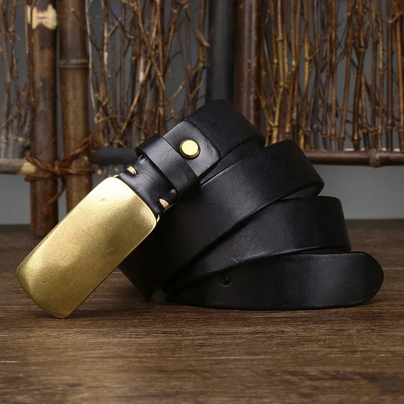 Classic men's accessory: full grain cowhide leather belt with an elegant forged brass buckle. Durable design.