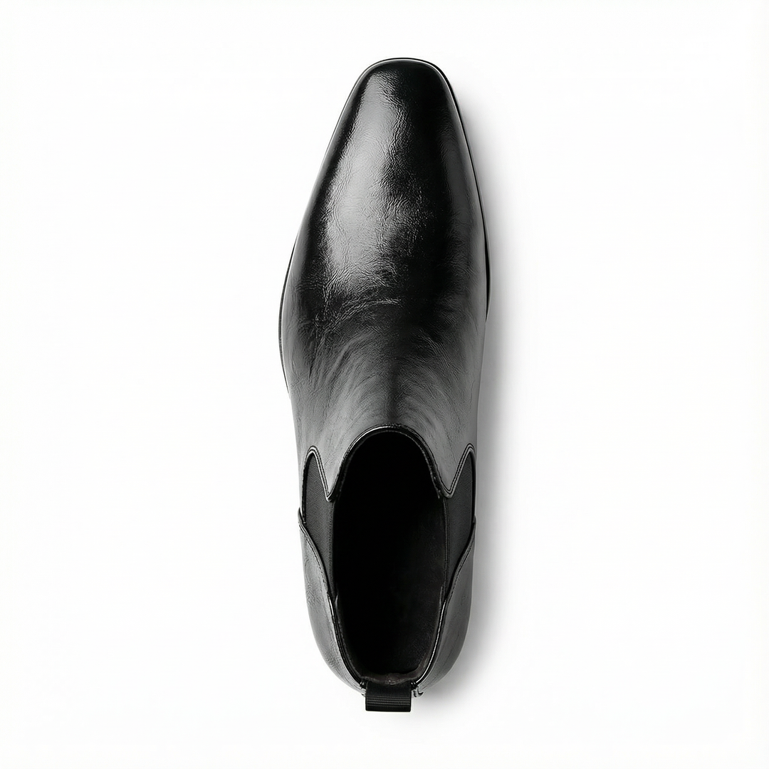 Close-up of the sole and heel of men's full-grain leather Chelsea boots, sturdy and comfortable