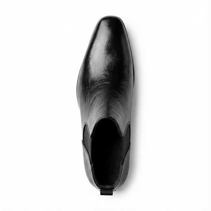 Close-up of the sole and heel of men's full-grain leather Chelsea boots, sturdy and comfortable