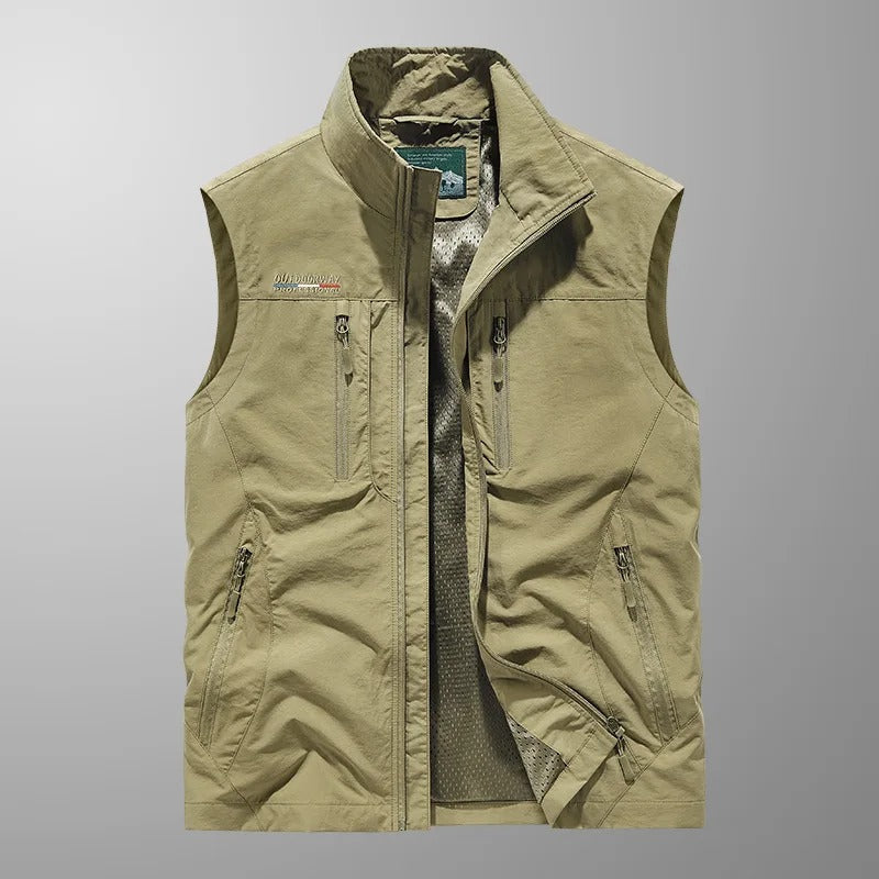 Durable men's outdoor vest, full zip design for warmth & active use. Sleeveless, ideal for layering.