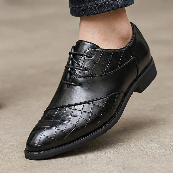 Close-up of a men's genuine leather Oxford shoe, showing fine stitching and durable sole