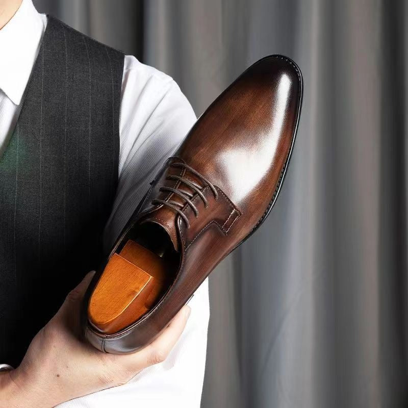 Classic black genuine leather men's dress shoes, stylish and comfortable formal footwear.