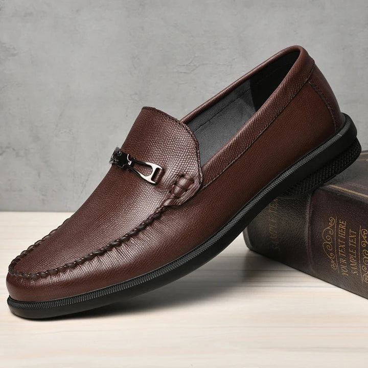 Comfortable men's leather loafers, dark brown, with a prominent golden metal bit.