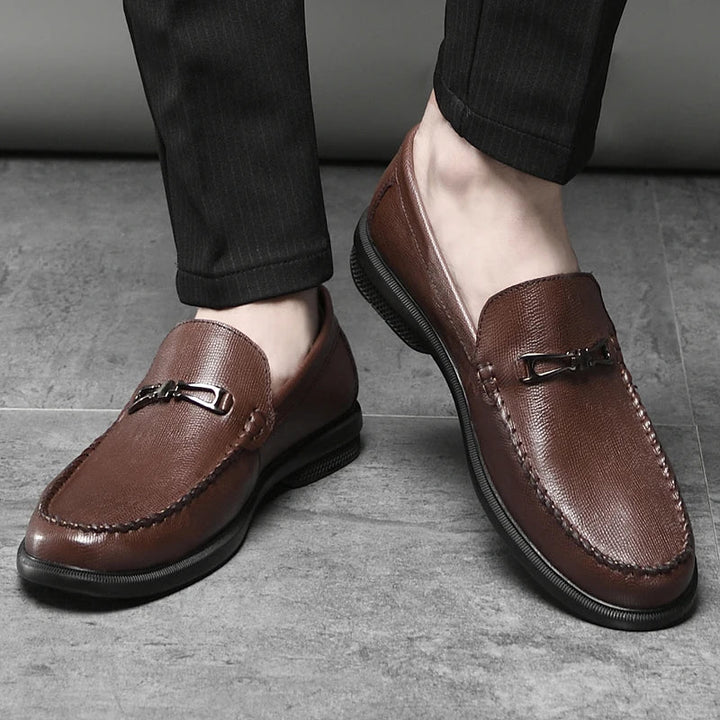 Fashionable men's leather loafers, grey, with a unique metal bit for contemporary footwear.