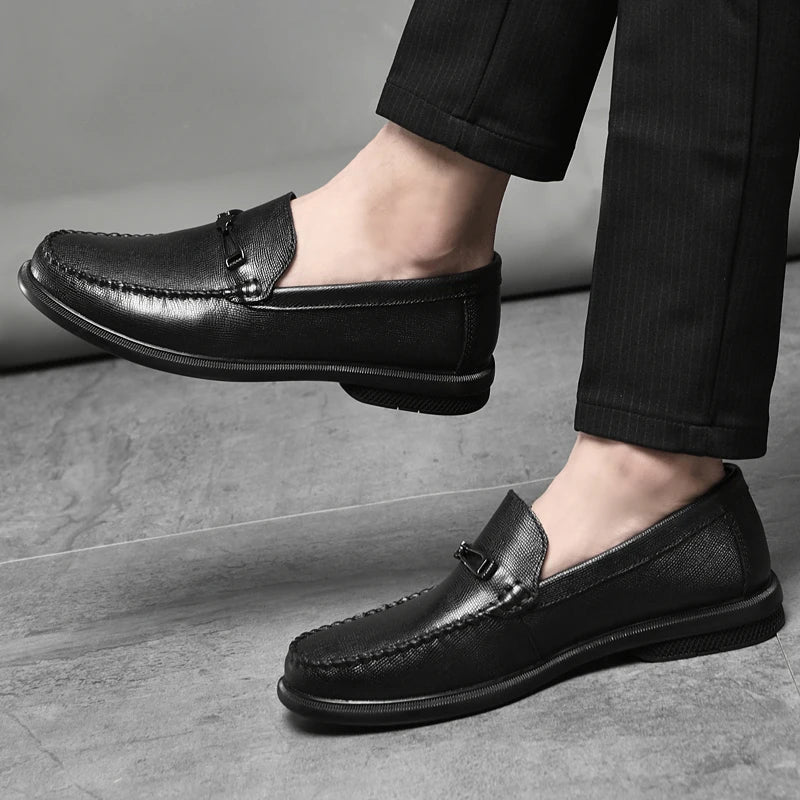 Classic men's dress shoes, genuine leather loafers in burgundy, featuring a stylish metal accent.