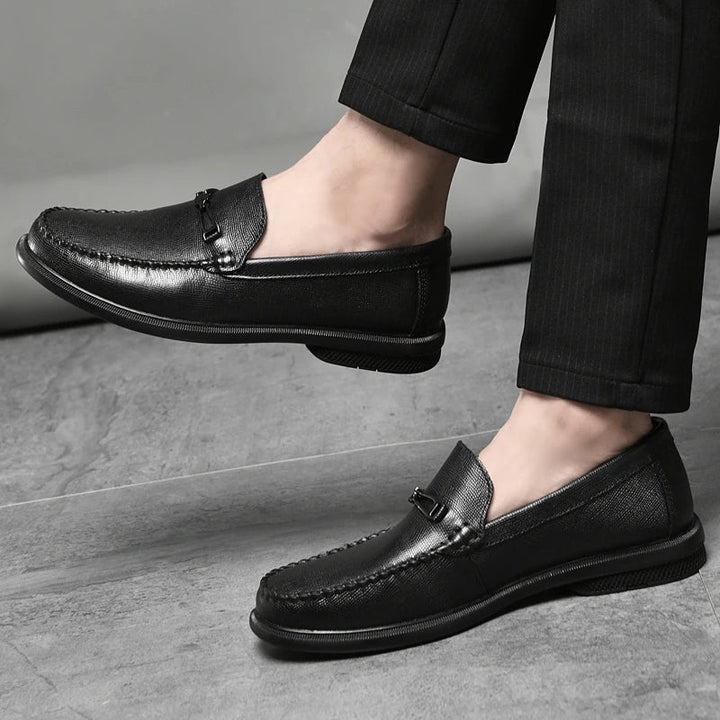 Classic men's dress shoes, genuine leather loafers in burgundy, featuring a stylish metal accent.