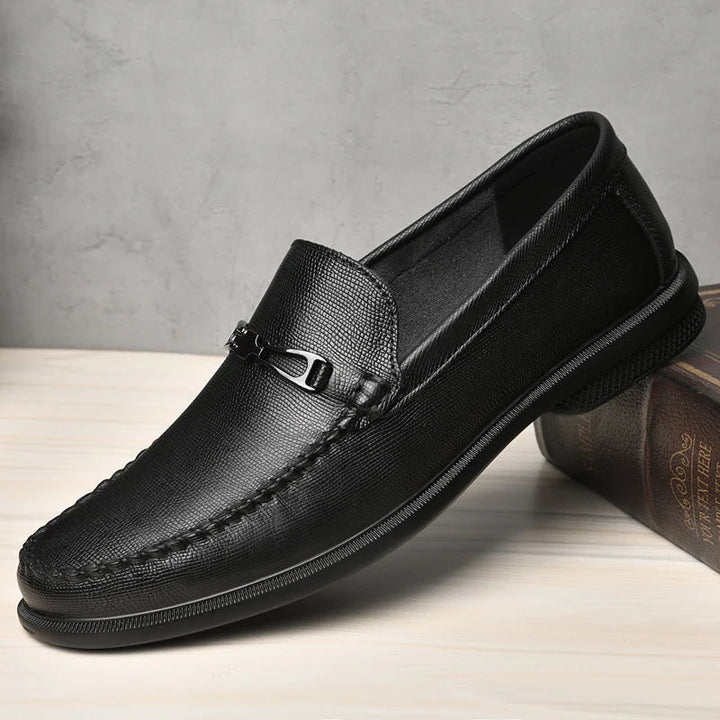Pair of men's leather loafers, tan, designed for both casual and formal fashion.